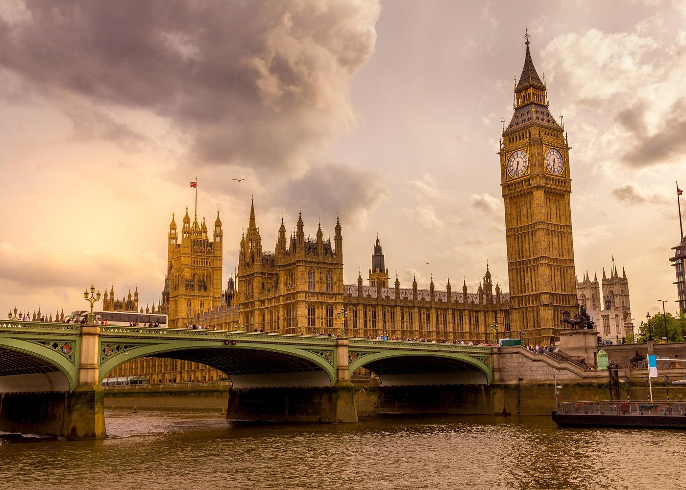 Big Ben and the Houses of Parliament beside the River Thames at dusk